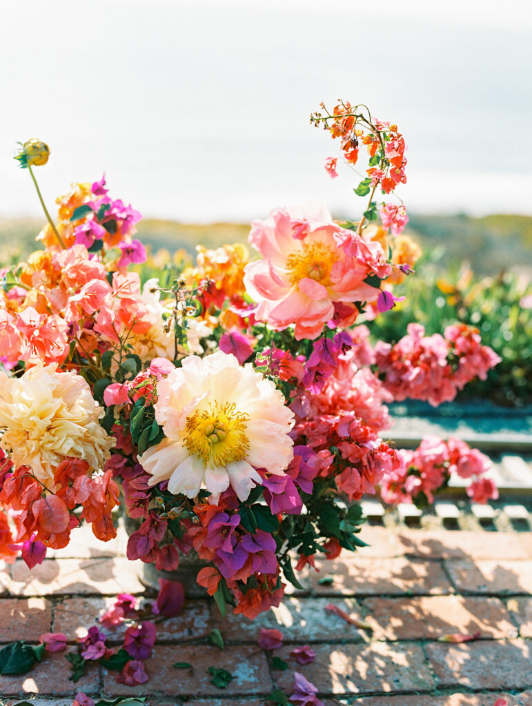 Wedding florals in a vibrant pink and magenta palette for the bride